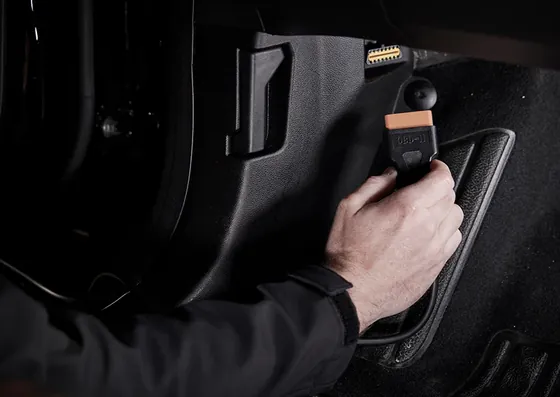 Vehicle diagnostic tool connected to an OBD port
